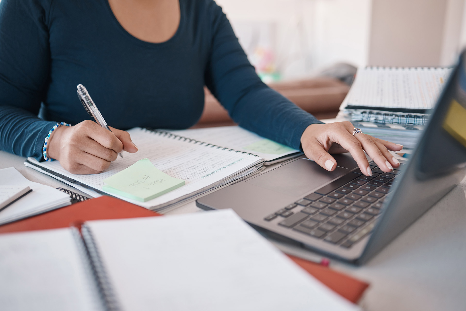 notebook-laptop-and-writing-hands-of-black-woman-o-ZDYYSGP.jpg